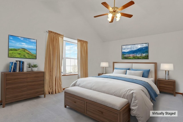 carpeted bedroom with high vaulted ceiling and ceiling fan