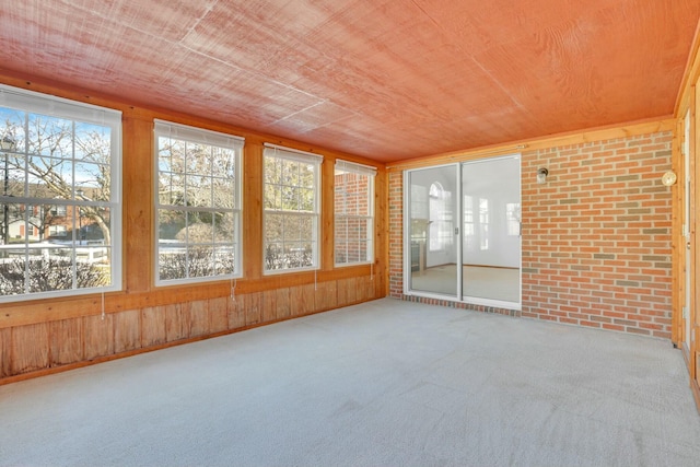 unfurnished sunroom featuring wooden ceiling