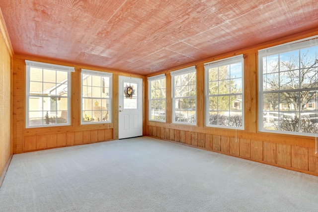 unfurnished sunroom featuring wooden ceiling