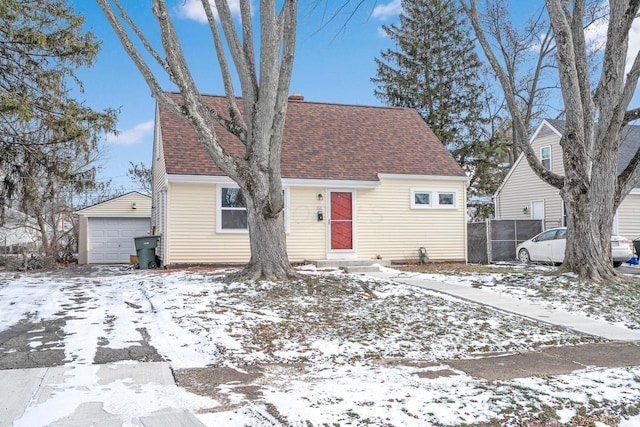 view of front of home featuring a garage and an outdoor structure