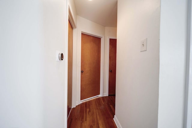 hall with dark hardwood / wood-style floors