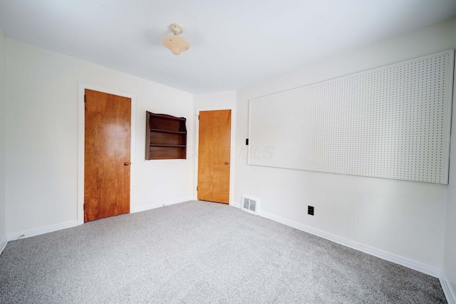 empty room with carpet flooring