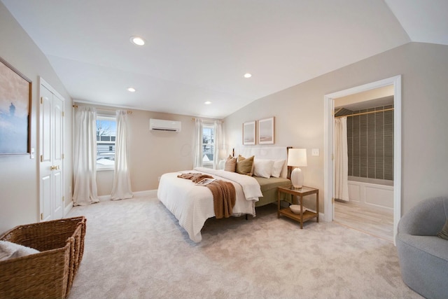 carpeted bedroom with lofted ceiling and a wall unit AC