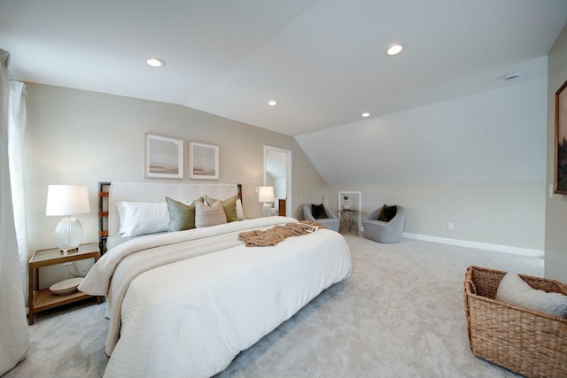 bedroom featuring vaulted ceiling and light colored carpet