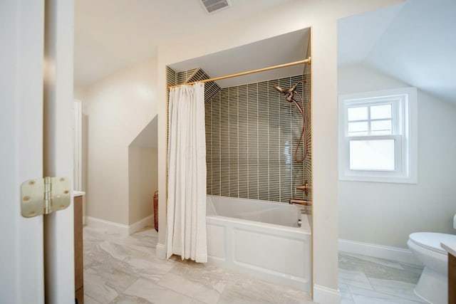 bathroom with lofted ceiling, shower / bathtub combination with curtain, and toilet