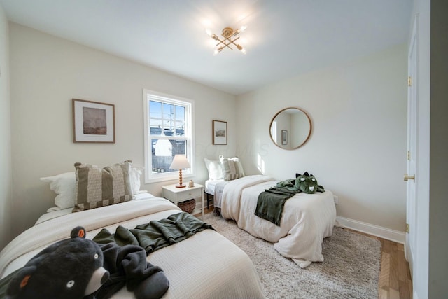 bedroom with hardwood / wood-style flooring