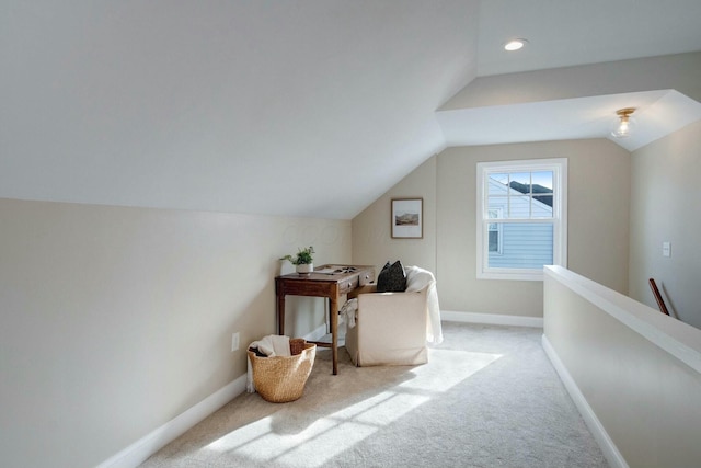 bonus room with light carpet and lofted ceiling