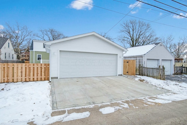 view of front of home with a garage and an outdoor structure