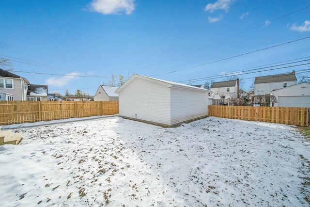 view of yard layered in snow