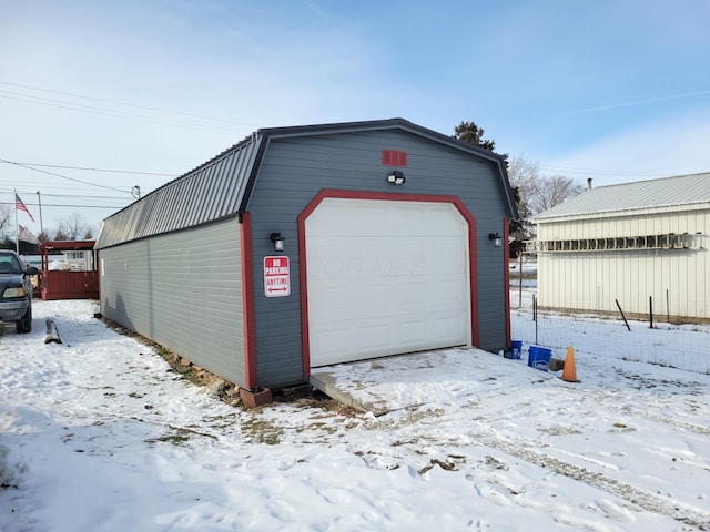 view of snow covered garage