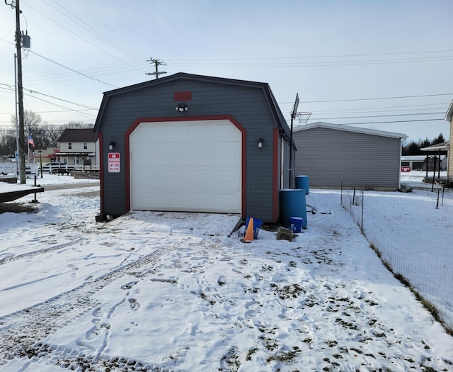 view of snow covered garage