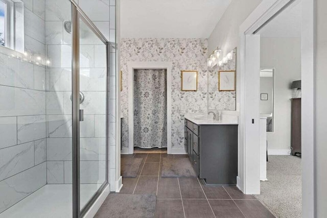 bathroom with vanity, a shower with shower door, and tile patterned flooring