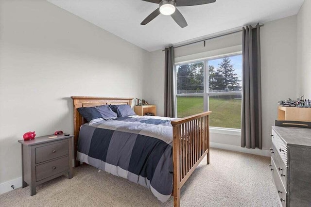 bedroom with light colored carpet and ceiling fan