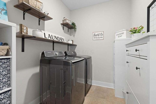 clothes washing area featuring washing machine and dryer