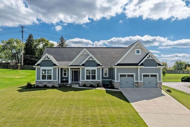 craftsman-style home featuring a garage and a front lawn