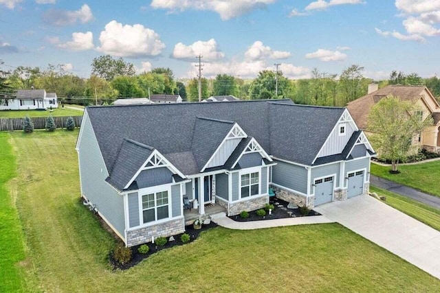 craftsman-style home featuring a front lawn