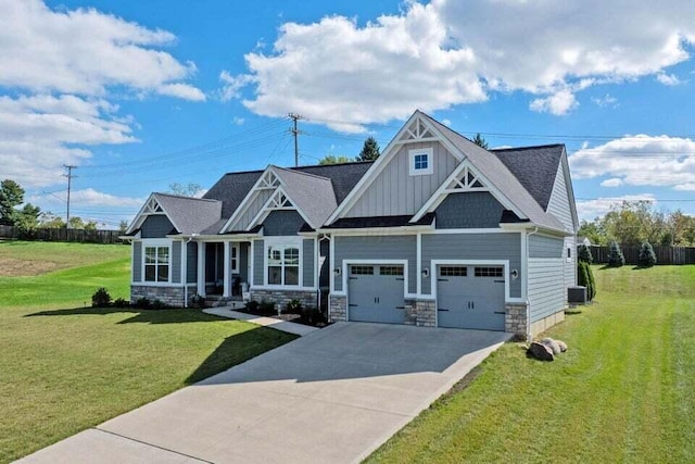 craftsman house with central AC, a garage, and a front lawn