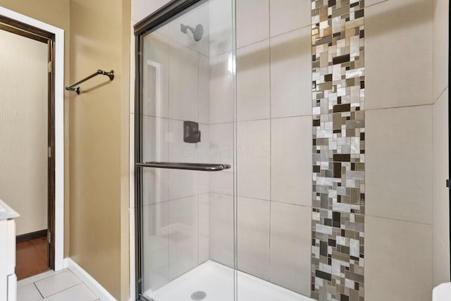 1973 Dartmouth Ave, Columbus, OH 43219 - bathroom with a stall shower, baseboards, and tile patterned flooring