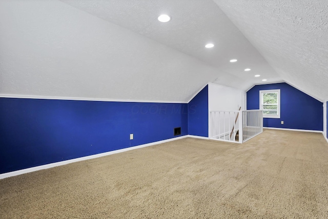 1973 Dartmouth Ave, Columbus, OH 43219 - additional living space with baseboards, carpet floors, vaulted ceiling, a textured ceiling, and recessed lighting