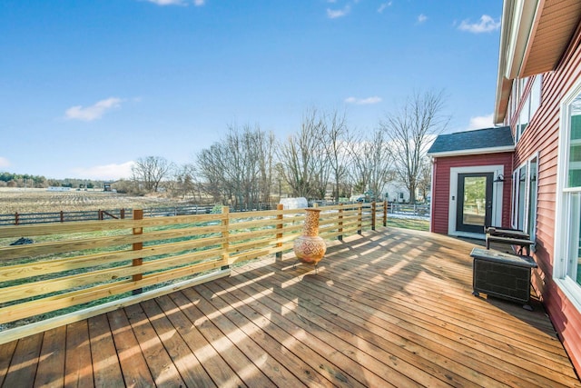 wooden terrace with a rural view and central AC unit