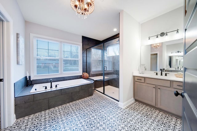 bathroom featuring tile patterned floors, vanity, shower with separate bathtub, and a chandelier