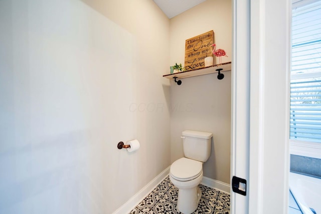 bathroom featuring tile patterned floors and toilet