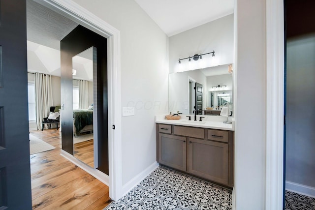 bathroom featuring hardwood / wood-style flooring and vanity