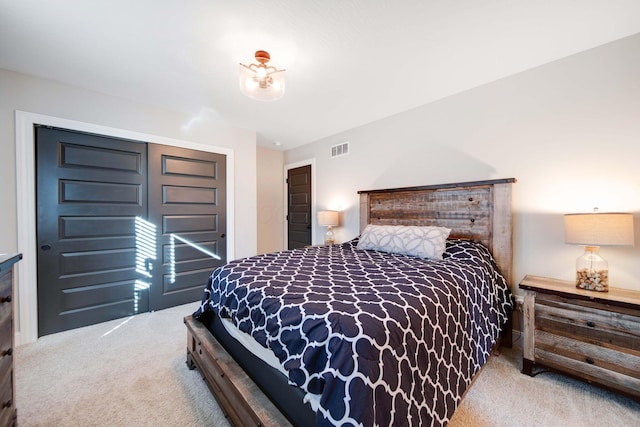 carpeted bedroom featuring a closet