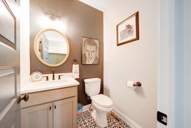 bathroom featuring tile patterned floors, vanity, and toilet