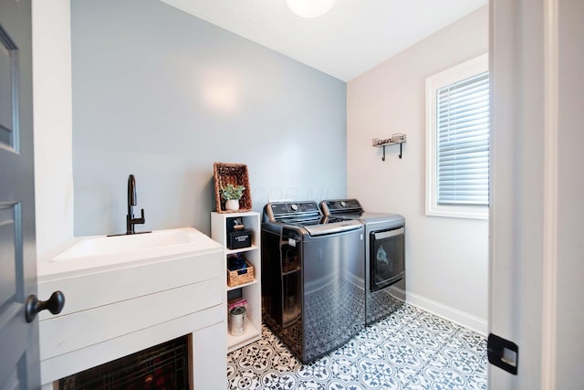 laundry room featuring light tile patterned flooring and washer and dryer