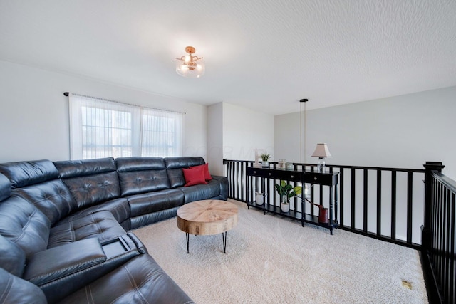 living room with carpet flooring and a textured ceiling