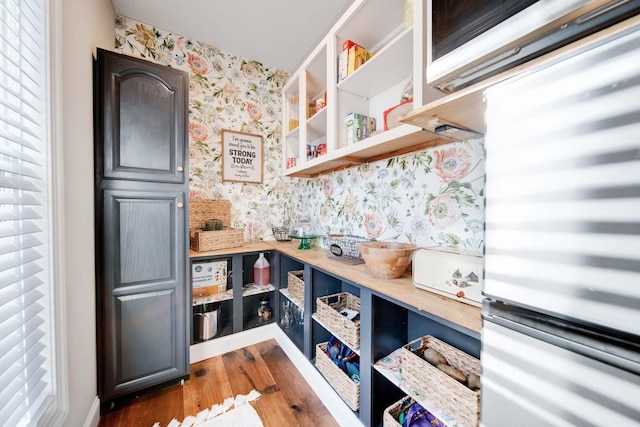 kitchen featuring dark wood-type flooring and wooden counters