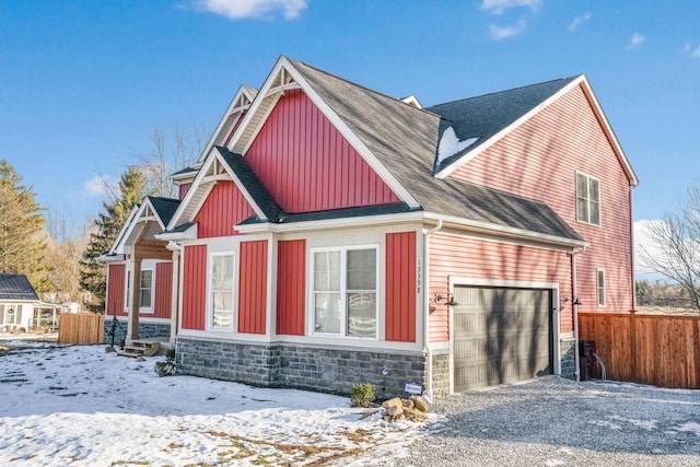 view of snow covered exterior featuring a garage