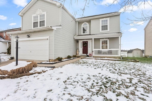 view of front property with a garage and covered porch