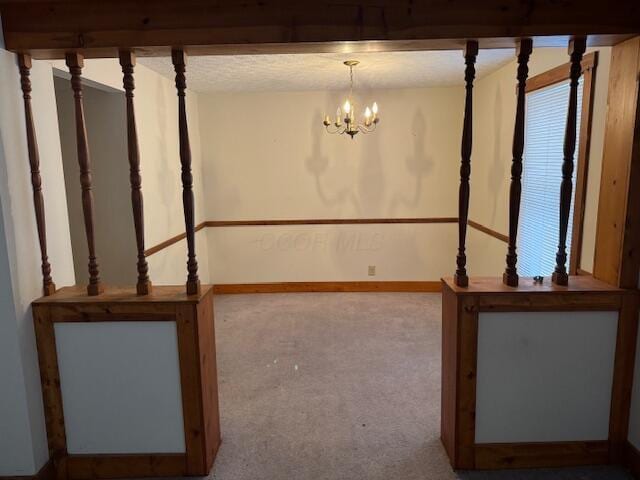 interior space featuring a chandelier and carpet