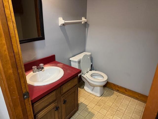 bathroom featuring toilet and vanity