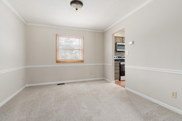 spare room with ornamental molding