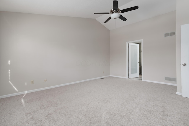 carpeted spare room with lofted ceiling and ceiling fan