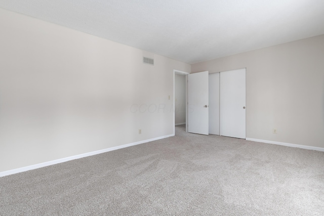 unfurnished bedroom with carpet floors