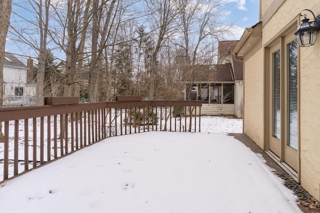 view of snow covered deck