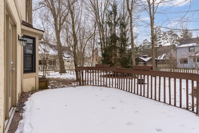 view of yard layered in snow