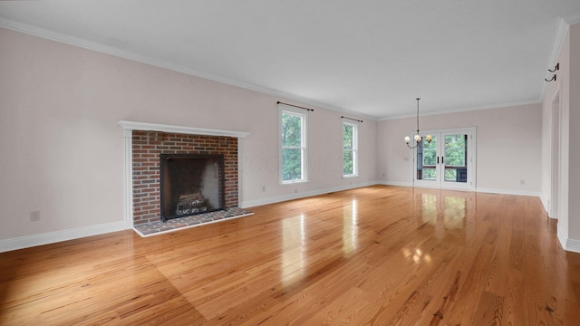 1859 Hardscrabble Rd, Alexandria, OH 43001 - unfurnished living room with light wood-style floors, a chandelier, baseboards, healthy amount of natural light, and crown molding