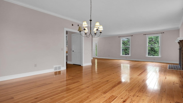 1859 Hardscrabble Rd, Alexandria, OH 43001 - unfurnished room with crown molding, a chandelier, light wood-style floors, baseboards, and a fireplace