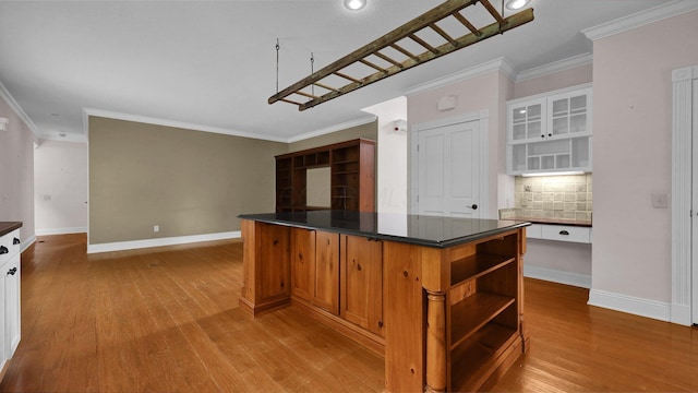 1859 Hardscrabble Rd, Alexandria, OH 43001 - kitchen featuring open shelves, dark countertops, tasteful backsplash, light wood-style flooring, and crown molding