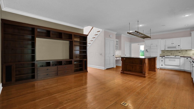 1859 Hardscrabble Rd, Alexandria, OH 43001 - unfurnished living room with crown molding, wood finished floors, baseboards, and recessed lighting