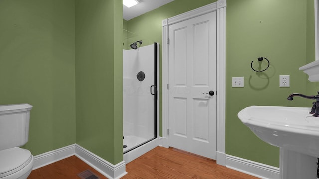 1859 Hardscrabble Rd, Alexandria, OH 43001 - bathroom with a shower stall, wood finished floors, toilet, and baseboards