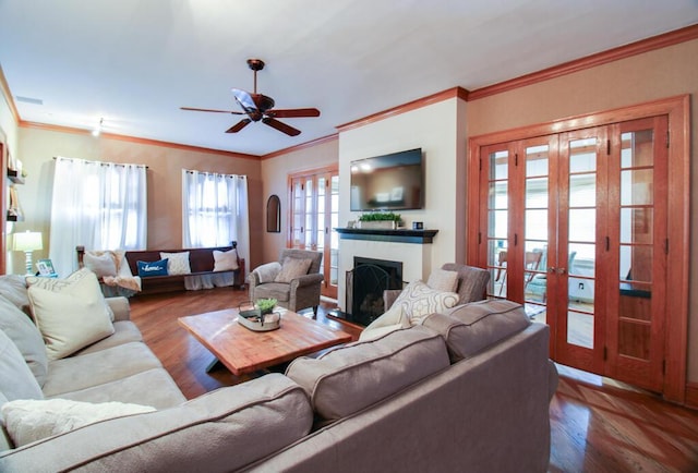 living room with crown molding, wood-type flooring, and french doors