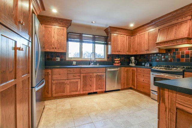 kitchen with premium range hood, appliances with stainless steel finishes, sink, and decorative backsplash