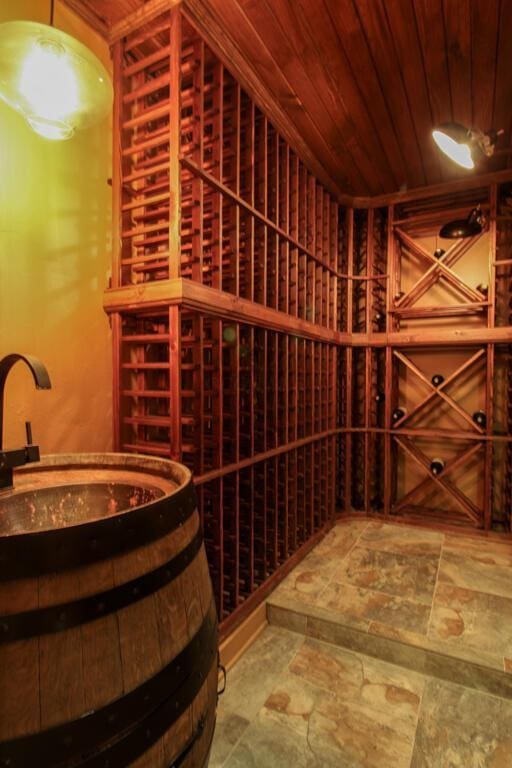 wine cellar featuring wooden ceiling