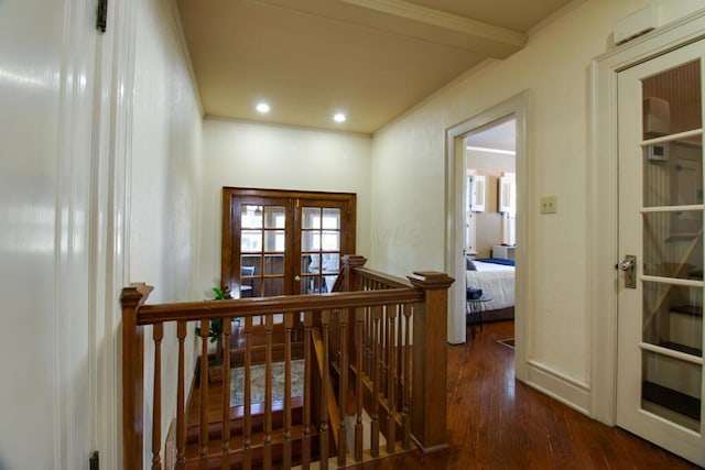 hall featuring crown molding, dark hardwood / wood-style floors, and french doors